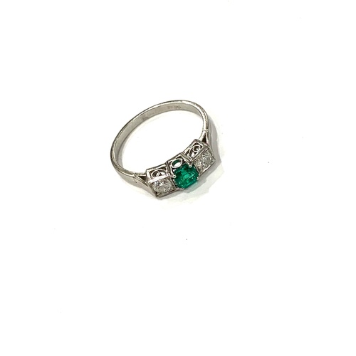 177 - Emerald and diamond ring, set in platinum, central emerald measures: 4mm by 4mm, set with diamond ei... 