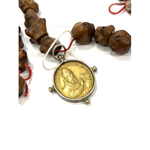 182 - Carved wooden beaded necklace with early medallions