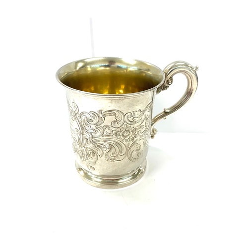 90 - Victorian chased presentation mug and saucer, engraved, total overall weight: 295g