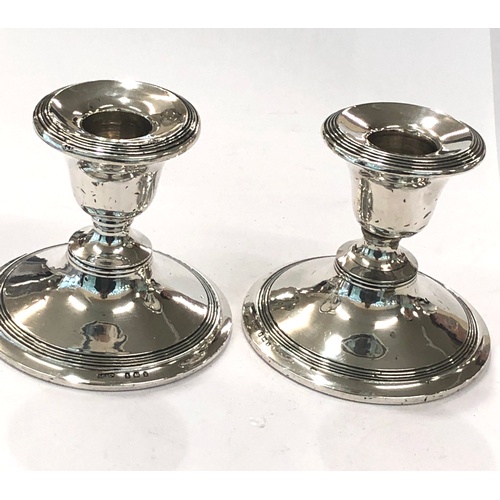 110 - Pair silver hallmarked candle sticks, approximate height: 8cm.