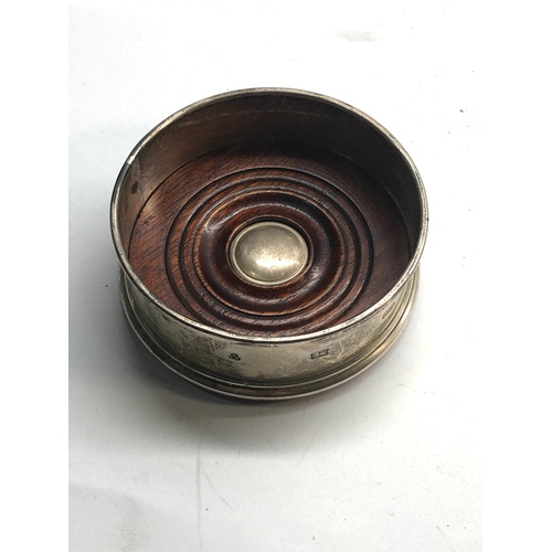 68 - small silver wine coaster measures approx 9.3cm dia