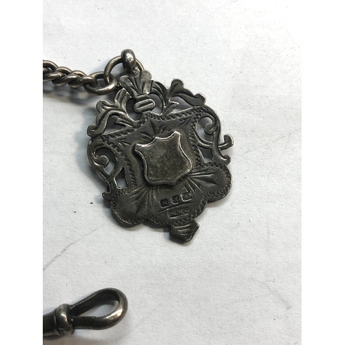 69 - antique silver vesta case and albert chain with fob dent to vesta as shown total weight 65g