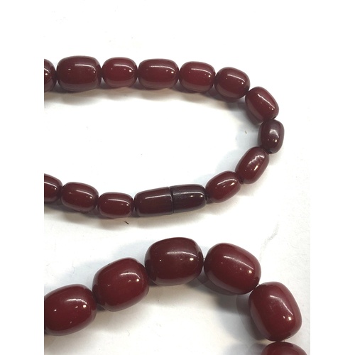 184 - large barrel shaped cherry amber / bakelite bead necklace graduated beads with internal streaking la... 