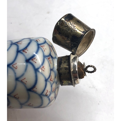 116 - antique silver top perfume bottle in uncleaned condition measures approx 8.5 cm dutch sword silver h... 