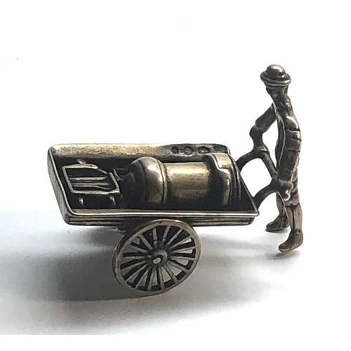 112 - Dutch silver miniature man pushing trolly