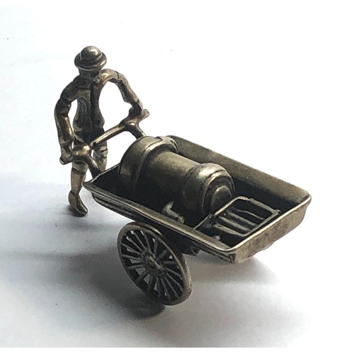 112 - Dutch silver miniature man pushing trolly