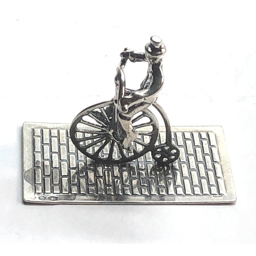 115 - Dutch silver miniature man on penny farthing