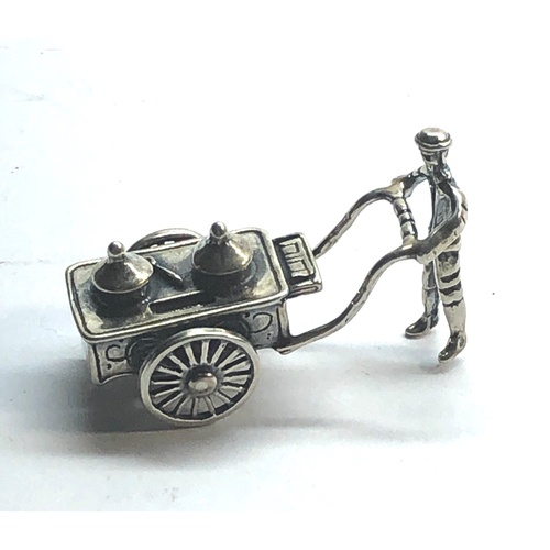 116 - Dutch silver miniature man pushing cart