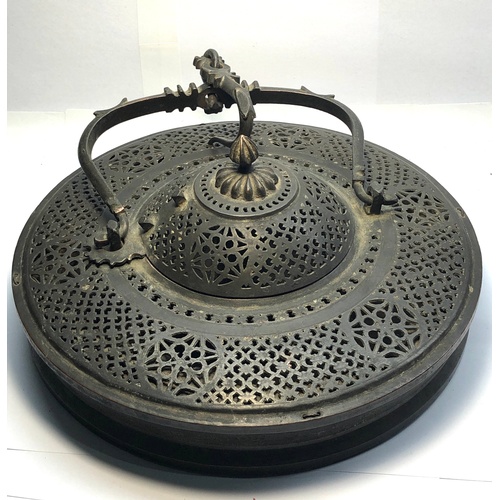 393 - Islamic type bronze pierced lidded hanging incense burner measures approx 9.5ins dia as shown condit... 