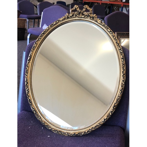 63 - Gilt framed oval mirror, overall good condition, approximate measurements: Height 23 inches, Width 1... 