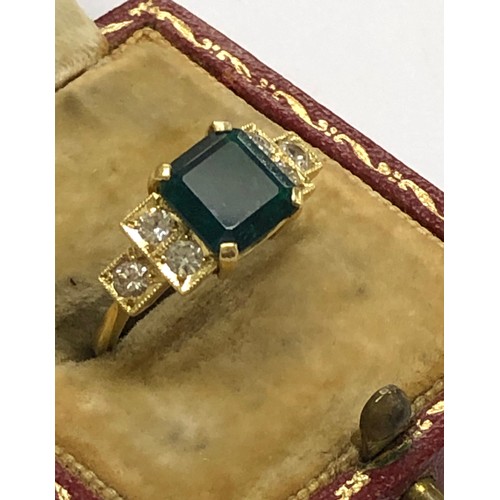 215 - 18ct diamond and emerald ring central emerald measures approx 8mm sq with diamonds each side