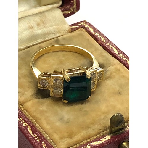 215 - 18ct diamond and emerald ring central emerald measures approx 8mm sq with diamonds each side