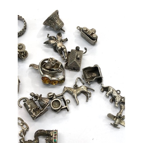 224 - Selection of vintage silver charm bracelet charms weight 100g