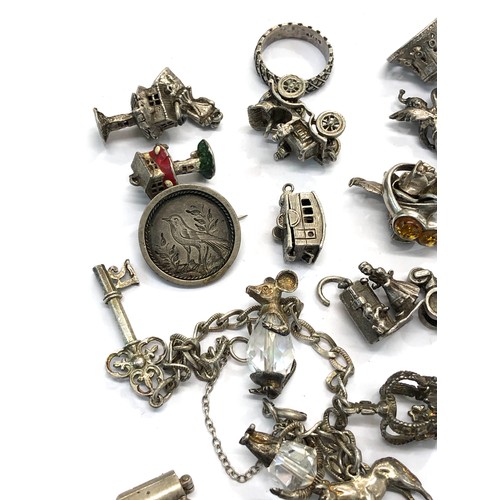 224 - Selection of vintage silver charm bracelet charms weight 100g