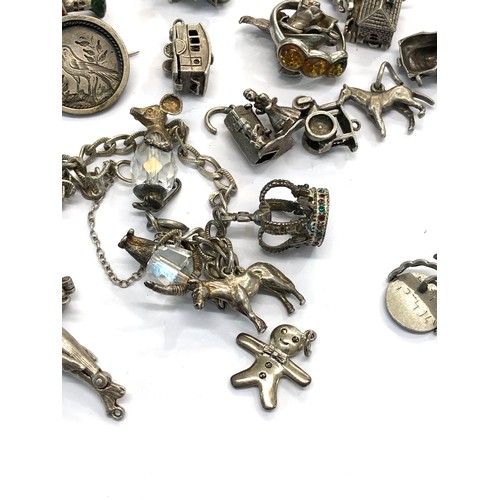 224 - Selection of vintage silver charm bracelet charms weight 100g