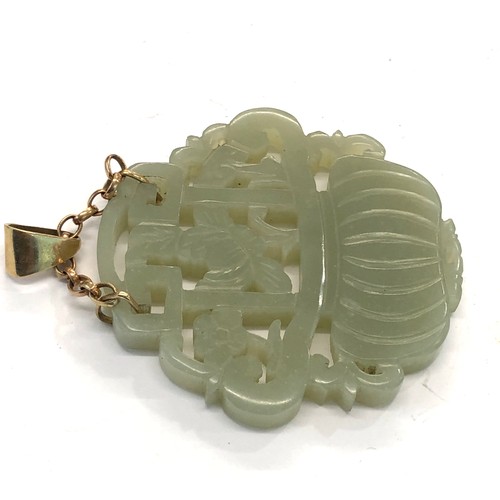 226 - Large 9ct gold and jade type pendant pendant measures approx 55mm by 55mm please see images for deta... 