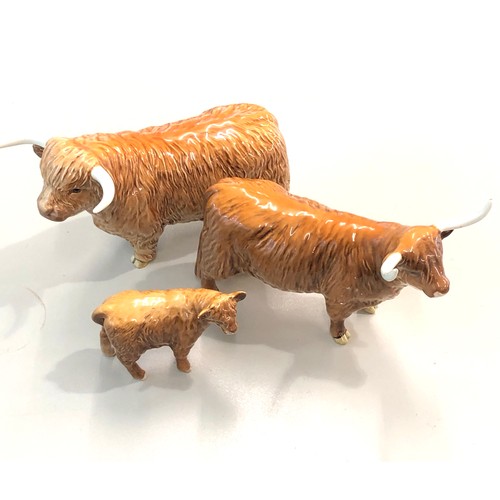 397 - Beswick Highland bull, cow and a calf, overall good condition