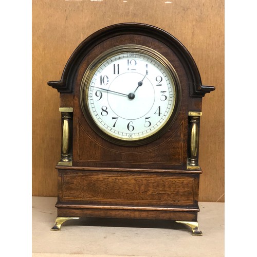 384 - Small antique inlaid mahogany clock glass loose will tick when shaken but stops no warranty given me... 