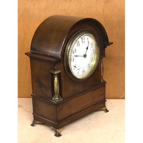 384 - Small antique inlaid mahogany clock glass loose will tick when shaken but stops no warranty given me... 