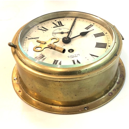 387 - Vintage Smiths Empire ships bulkhead clock the clock winds and ticks but no warranty given measures ... 