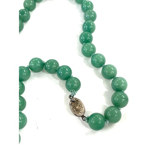 356 - Jade necklace with silver clasp, approximate length of necklace: 63 cms