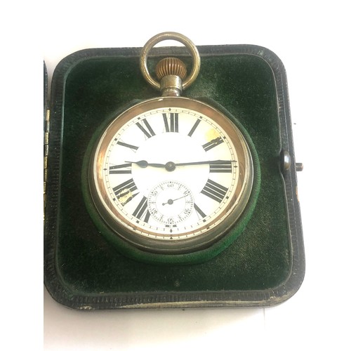 155 - Antique silver travel cased goliath pocket watch, watch ticks but stops, damage to dial, the watch m... 