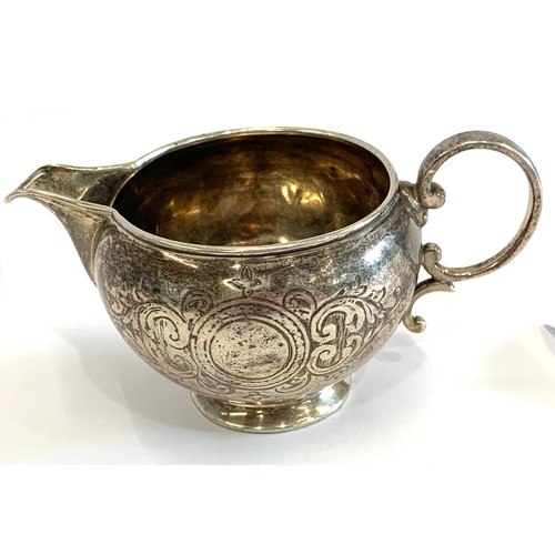 66 - Engraved victorian silver cream jug by George Adams London 1874