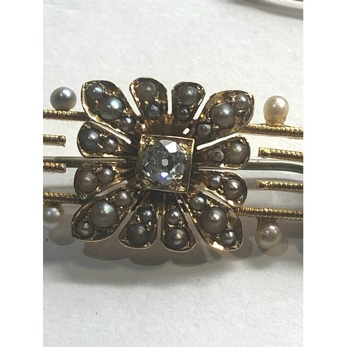 245 - Antique 15ct gold diamond and pearl brooch measures approx 4.5 cm by 1.5cm central diamond measures ... 