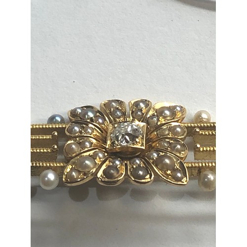 245 - Antique 15ct gold diamond and pearl brooch measures approx 4.5 cm by 1.5cm central diamond measures ... 