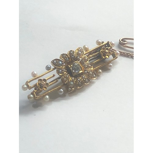 245 - Antique 15ct gold diamond and pearl brooch measures approx 4.5 cm by 1.5cm central diamond measures ... 