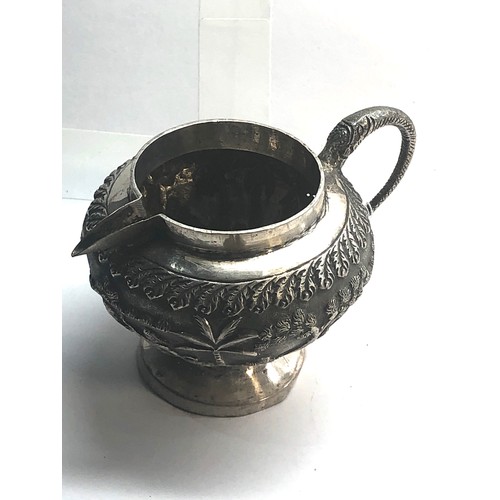 9 - Antique silver Asian embossed milk jug measures approx height 7.2cm by 11cm wide please see images f... 