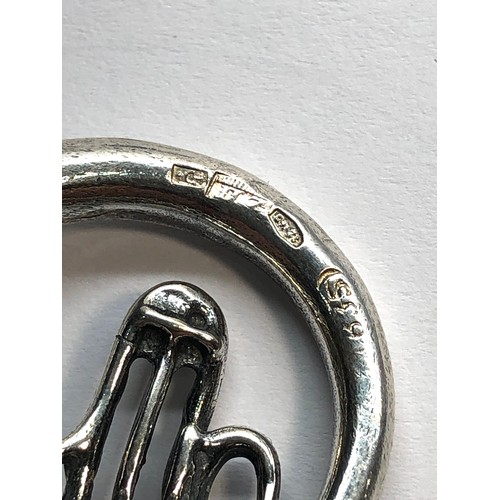 33 - Dutch silver miniature French horn dutch silver sword hallmark measures approx  3.8 cm by 3.6cm