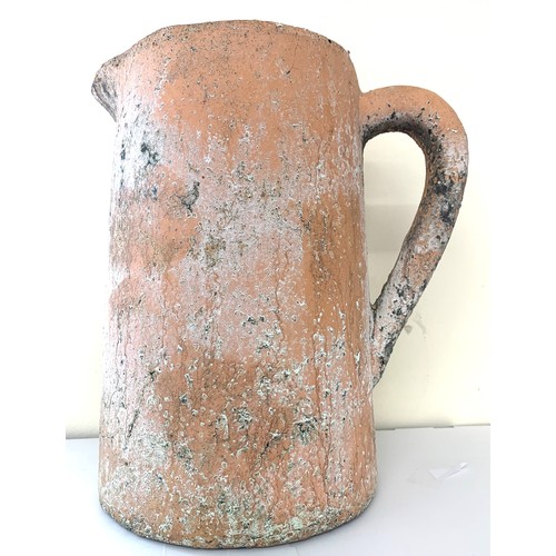 141 - A terracotta vintage jug, age related wear, approximate measurements: Height 12 inches, Width inc ha... 