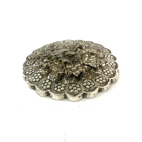 12 - Asian silver hand mirror highly decorative measures approx 13cm dia not hallmarked but tested as sil... 