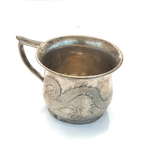 24 - Small Chinese silver dragon mug measures approx 4.2cm by 5.5mm dia age related marks and dents