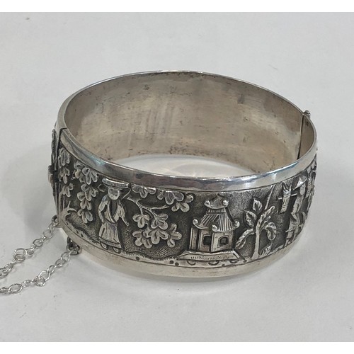 88 - Fine vintage Chinese silver bangle embossed with Chinese scenes measures approx 25mm wide by 6cm dia... 