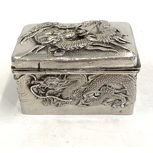 109 - Japanese silver box depicting dragons, approximate measurements: Width 7.5cm, Depth 5cm, Height 4.5c... 