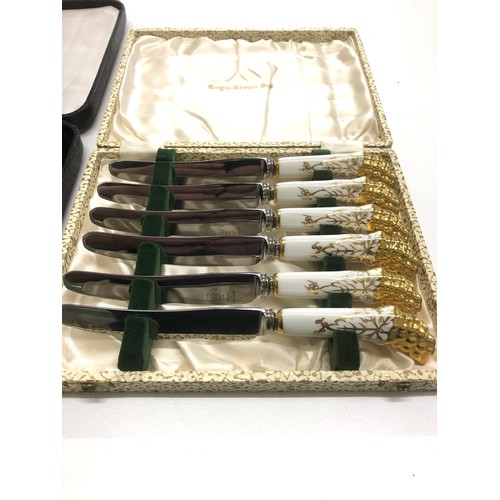 57 - Boxed set of 6 Royal Crown Derby knives in original box with a set of 6 boxed bird spoons