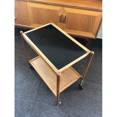 423 - Retro teak two tier tea trolley, one leg damaged as shown in images