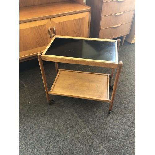 423 - Retro teak two tier tea trolley, one leg damaged as shown in images