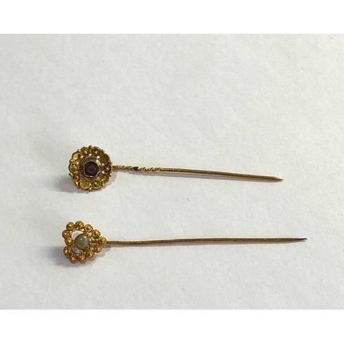 143 - 2 antique dutch gold stick pins acid test at least 14ct one set wit pearl the other an amethyst meas... 