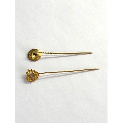 143 - 2 antique dutch gold stick pins acid test at least 14ct one set wit pearl the other an amethyst meas... 