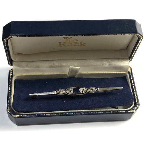 144 - Art deco 18ct gold diamond and sapphire brooch measures approx 63mm wide weight 3.5g please see imag... 