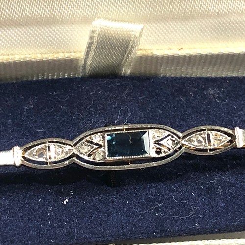 144 - Art deco 18ct gold diamond and sapphire brooch measures approx 63mm wide weight 3.5g please see imag... 