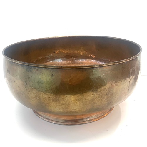 56 - Large hammered copper bowl, measures approx 29cm diameter by 14cm heigh