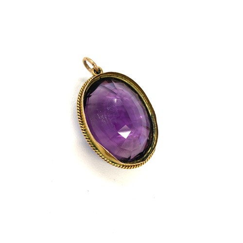 148 - Antique gold mounted amethyst pendant measures approx 3cm by 2.3cm