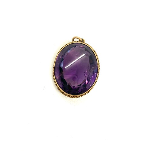 148 - Antique gold mounted amethyst pendant measures approx 3cm by 2.3cm