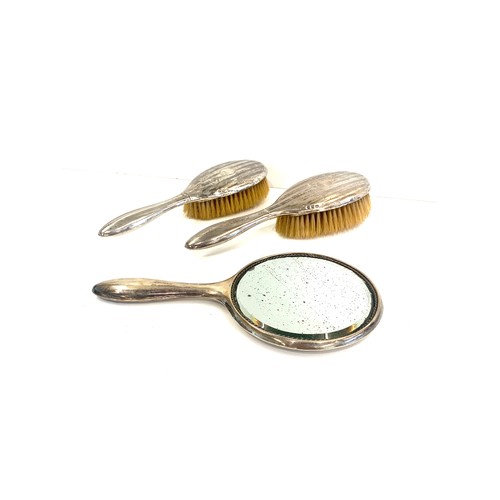 60 - Hallmarked silver dressing table set, 2 brushes and a hand held mirror