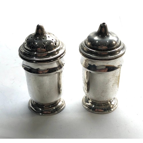 72 - Silver salt and pepper sheffield silver hallmarks makers EV measures approx 8cm  total weight 94g