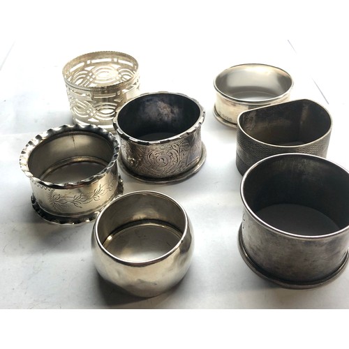 79 - 7 silver napkin rings weight 115g